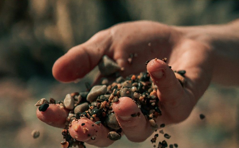 Seed pouring from a farmer's hands